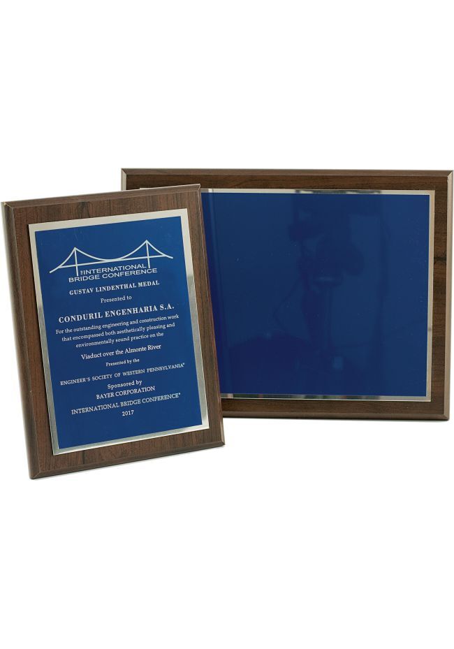 Commemorative wooden plaque in blue with silver border